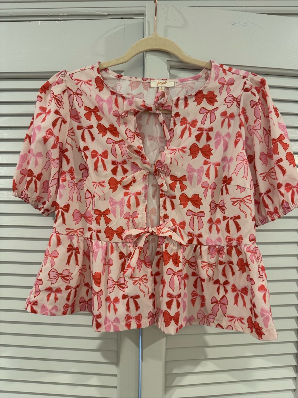 Peach Love California Pink & Red Bow-Print Tie Front Peplum Blouse